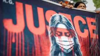 A doctor holds a banner during a protest demanding justice following the rape and murder of a trainee medic at a hospital in Kolkata. Reuters