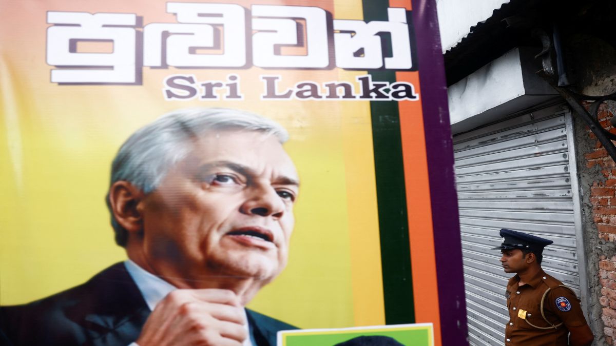 A policeman stands guard next to a poster of Sri Lanka's President Ranil Wickremesinghe at a residential area in Colombo, Sri Lanka. Reuters A policeman stands guard next to a poster of Sri Lanka's President Ranil Wickremesinghe at a residential area in Colombo, Sri Lanka. Reuters