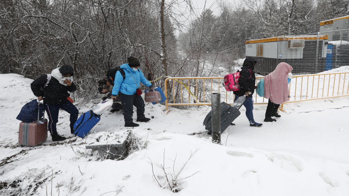 People at the Roxham Road border crossing in Champlain, New York, A rising number of Indians are using the US-Canada border to illegally gain access into America. Representational image/AFP People at the Roxham Road border crossing in Champlain, New York, A rising number of Indians are using the US-Canada border to illegally gain access into America. Representational image/AFP
