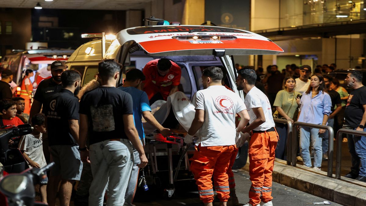A person is carried on a stretcher outside American University of Beirut Medical Center (AUBMC) as people, including Hezbollah fighters and medics, were wounded and killed when the pagers they use to communicate exploded across Lebanon. Reuters A person is carried on a stretcher outside American University of Beirut Medical Center (AUBMC) as people, including Hezbollah fighters and medics, were wounded and killed when the pagers they use to communicate exploded across Lebanon. Reuters