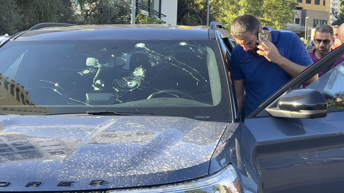 Police officers inspect a car inside of which a hand-held pager exploded in Beirut, Lebanon. AP Police officers inspect a car inside of which a hand-held pager exploded in Beirut, Lebanon. AP