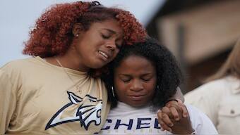 A woman cries as people attend a vigil at Jug Tavern Park following a shooting at Apalachee High School in Winder, Georgia, US. Reuters