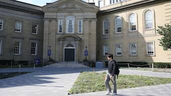 A student walks in front of the University of Toronto, St. George campus, in Toronto, Ontario. The 24-hour work limit for foreign students will affect Indians. Representational picture/Reuters