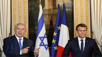 Israeli Prime Minister Benjamin Netanyahu speaks as French President Emmanuel Macron looks on during a joint news conference following their meeting at the Elysee Palace in Paris on December 10, 2017. File Image: AFP