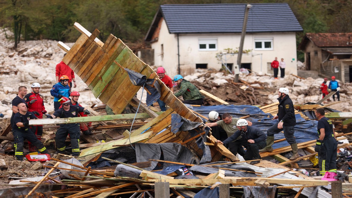Rescuers search for missing people after floods and landslides in the village of Donja Jablanica, Bosnia. AP Rescuers search for missing people after floods and landslides in the village of Donja Jablanica, Bosnia. AP