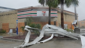 An apparent tornado caused by Hurricane Milton, tore the awning off a 7-Eleven convenient store, Wednesday, October 9, 2024, in Cape Coral, Florida. AP