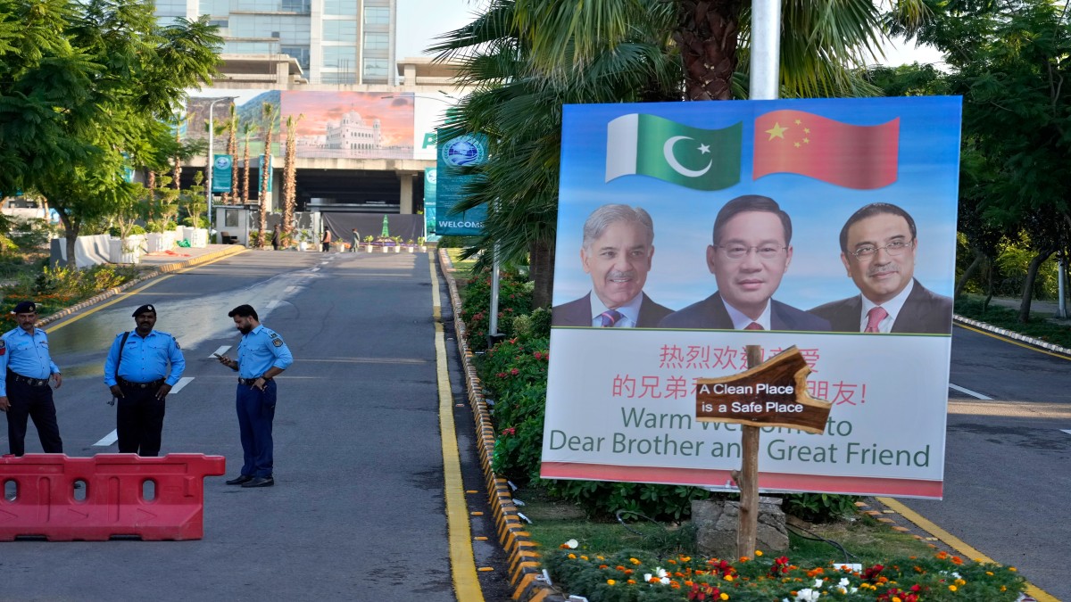 Police officers stand guard next to a welcoming billboard with portraits of China's Premier Li Qiang, center, Pakistan's Prime Minister Shehbaz Sharif and President Asif Ali Zardari, displayed at a road leading to the venue of the upcoming Shanghai Cooperation Organization (SCO) summit in Islamabad, Pakistan. AP Police officers stand guard next to a welcoming billboard with portraits of China's Premier Li Qiang, center, Pakistan's Prime Minister Shehbaz Sharif and President Asif Ali Zardari, displayed at a road leading to the venue of the upcoming Shanghai Cooperation Organization (SCO) summit in Islamabad, Pakistan. AP