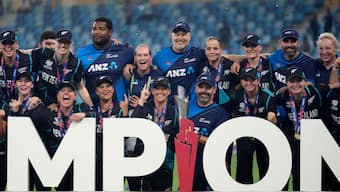 The New Zealand team pose with the Women's T20 World Cup title after beating South Africa in the final in Dubai on Sunday. AP 