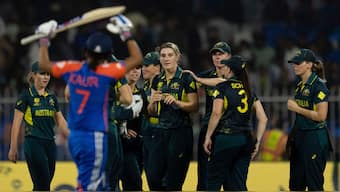 Australia defeated India by nine runs despite Harmanpreet Kaur's unbeaten 54 to become the first team to qualify for the Women's T20 World Cup semi-finals with four wins in as many outings. AP