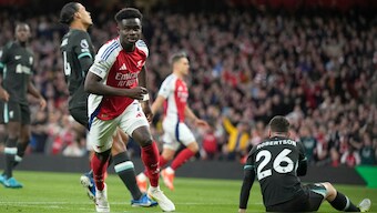 Arsenal's Bukayo Saka celebrates after scoring against Liverpool. AP