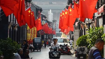 China to provide $1.8 trillion to help debt-stricken local govts Source: AFP.