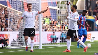 Liverpool's Diogo Jota celebrates with Mohamed Salah after scoring the only goal of the Premier League away game against Crystal Palace. Reuters 