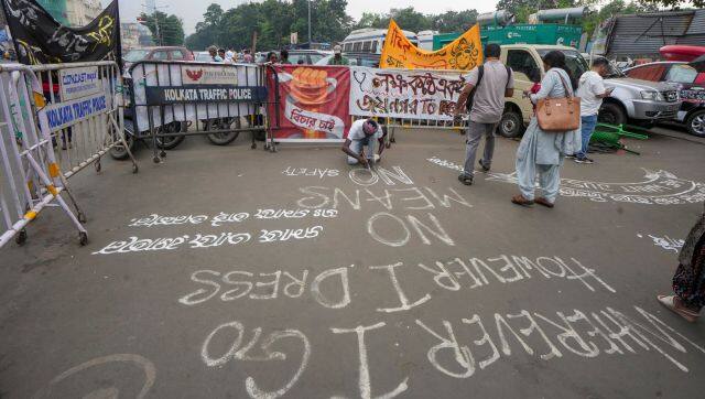 An agitator paints slogans on a road at the site of the hunger strike by junior doctors in protest against the alleged sexual assault and murder of a trainee doctor, in Kolkata, West Bengal. PTI