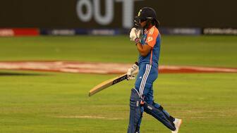 India captain Harmanpreet Kaur walks back after being dismissed for 15 by Rosemary Mair. AP 