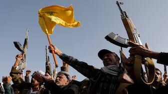 Supporters raise a Hezbollah flag on Sept. 27, 2024. File image/AP 