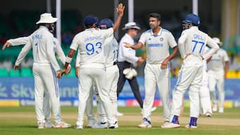 Senior India off-spinner Ravichandran Ashwin celebrates with teammates after dismissing Bangladesh batter Mominul Haque on Day 5 of the second Test in Kanpur. PTI