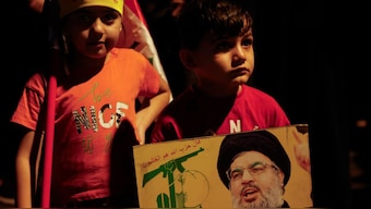 An Iraqi child holds a picture of Lebanon's Hezbollah leader Sayyed Hassan Nasrallah as he attends a protest following the announcement of his death, in Baghdad, Iraq, September 28, 2024. Source: REUTERS.