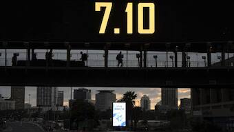 People cross abridge wuth the date 7.10, marking one-year-anniversary of the Hamas attack on Israel, in Ramat Gan, Israel. Source: AP.