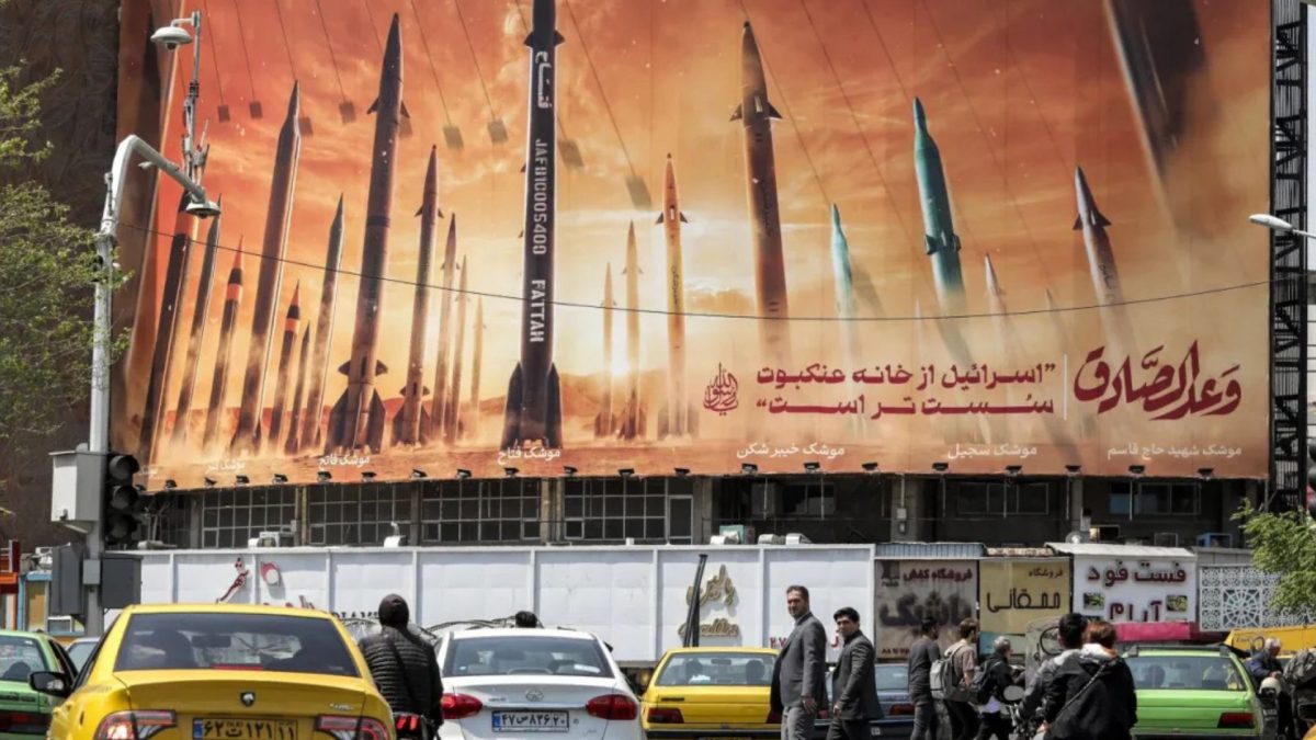 Cars pass a billboard depicting Iranian ballistic missiles on Valiasr Square in central Tehran. Source: AFP | FILE | Representational Image. Cars pass a billboard depicting Iranian ballistic missiles on Valiasr Square in central Tehran. Source: AFP | FILE | Representational Image.