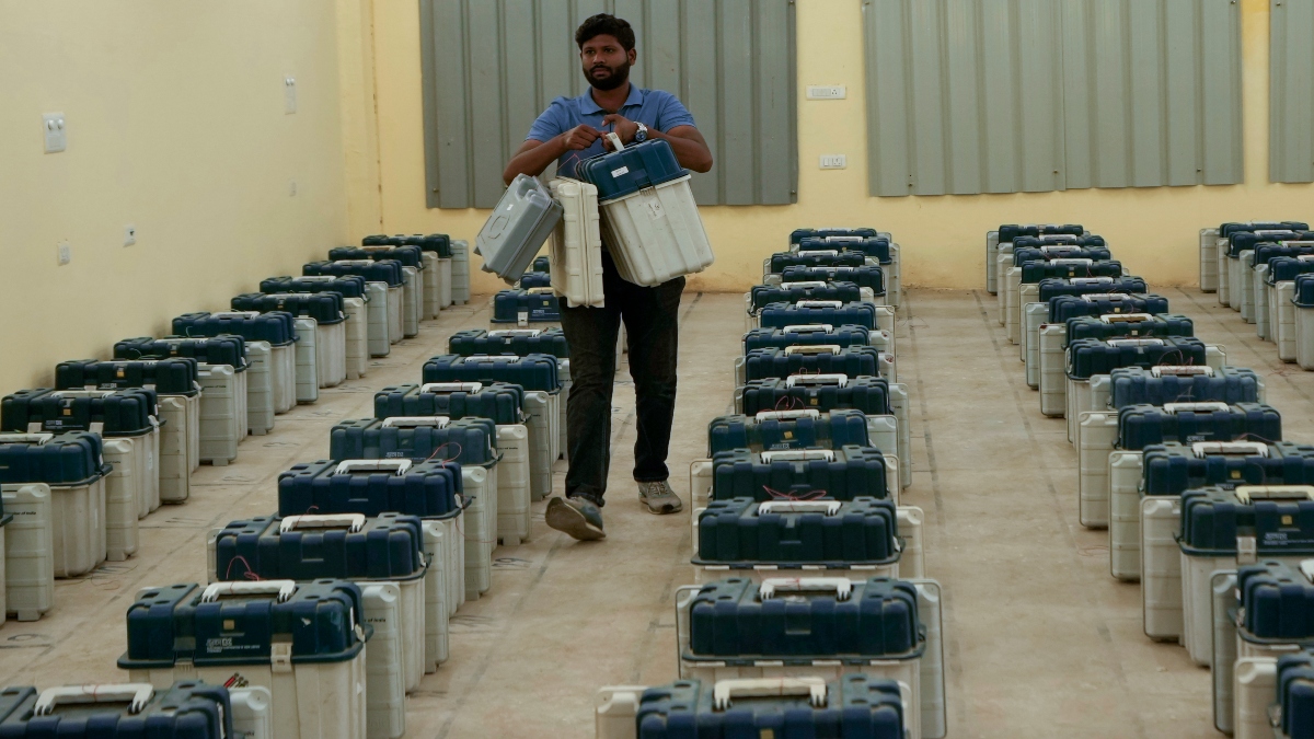 A polling official carries electronic voting machines and other election material for distribution on the eve of the third phase of the Jammu and Kashmir Assembly election, in Jammu, on Monday. AP A polling official carries electronic voting machines and other election material for distribution on the eve of the third phase of the Jammu and Kashmir Assembly election, in Jammu, on Monday. AP