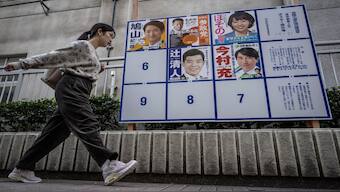 A woman walks past campaign posters for the House of Representatives election in Tokyo. Reuters