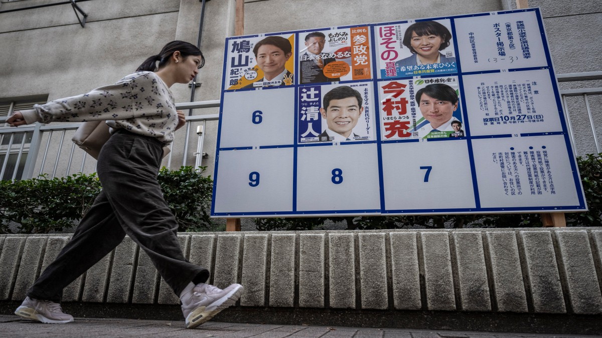 A woman walks past campaign posters for the House of Representatives election in Tokyo. Reuters A woman walks past campaign posters for the House of Representatives election in Tokyo. Reuters