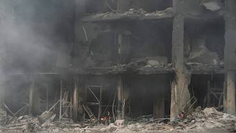 Smoke rises from destroyed buildings at the site of an Israeli airstrike hit in Choueifat, southeast of Beirut, Lebanon, on Monday. AP