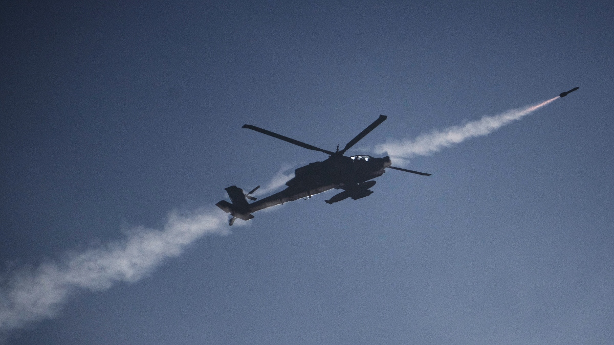 An Israeli Apache helicopter fires a missile towards southern Lebanon as seen from northern Israel, on Sunday. AP An Israeli Apache helicopter fires a missile towards southern Lebanon as seen from northern Israel, on Sunday. AP