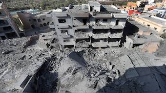 Destroyed buildings that were hit by Israeli airstrikes are seen in Qana village, south Lebanon, on Wednesday. AP 