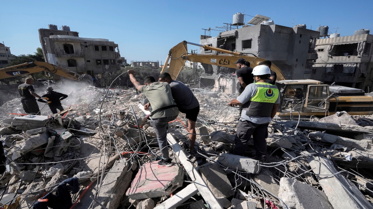 Rescue workers use excavators to remove the rubble of a destroyed building that was hit Tuesday night in an Israeli airstrike, as they search for victims in Sarafand, south Lebanon, on Wednesday. AP  Rescue workers use excavators to remove the rubble of a destroyed building that was hit Tuesday night in an Israeli airstrike, as they search for victims in Sarafand, south Lebanon, on Wednesday. AP