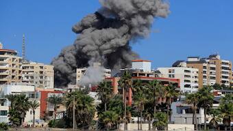 Smoke rises from buildings hit in an Israeli airstrike in Tyre, Lebanon, on October 23, 2024. AP