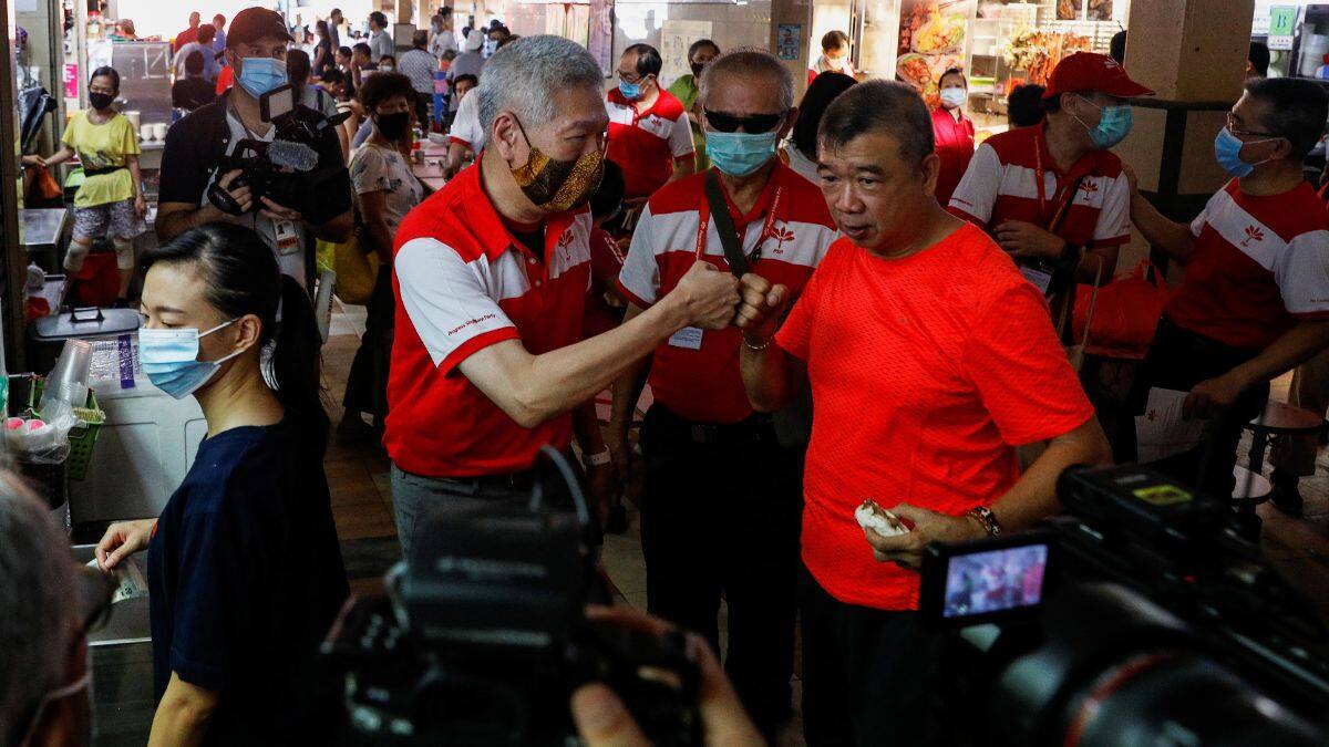Lee Hsien Yang of the Progress Singapore Party (PSP) greets people during a walkabout ahead of the general election in Singapore, June 28, 2020. File Image/Reuters