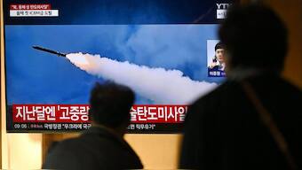 A man watches a television screen showing a news broadcast with file footage of a North Korean missile test, at a train station in Seoul on October 31, 2024. North Korea on October 31 fired a "long-range ballistic missile", South Korea's military said, Pyongyang's first weapons test since Seoul accused it of sending tens of thousands of soldiers to Russia. Source: AFP.