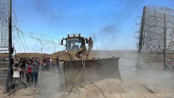 Palestinians break into the Israeli side of Israel-Gaza border fence after gunmen infiltrated areas of southern Israel, October 7, 2023. File Image/Reuters