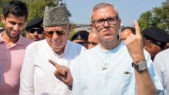 (File) Jammu and Kashmir National Conference (JKNC) president Farooq Abdullah and vice president Omar Abdullah show their fingers marked with indelible ink after casting vote during the second phase of Jammu and Kashmir Assembly elections, in Srinagar, on September 25, 2024. PTI