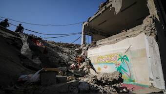 Palestinians view the damage at a school-turned-shelter hit in an Israeli strike on Sunday, amid the ongoing Israel-Hamas conflict, at Beach camp in Gaza City, October 28, 2024. Reuters