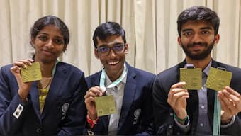 Grandmasters D Gukesh, R Praggnanandhaa and woman GM R Vaishali pose for photos at a felicitation ceremony after India won Gold medal in both open and women categories at the Chess Olympiad. PTI 