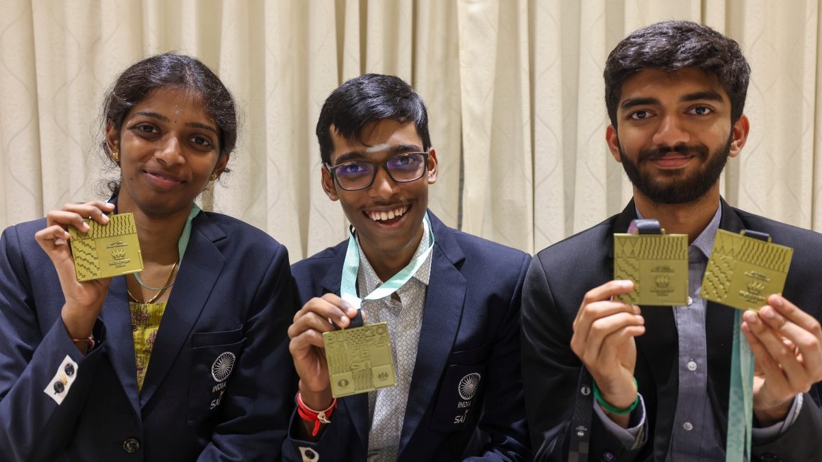 Grandmasters D Gukesh, R Praggnanandhaa and woman GM R Vaishali pose for photos at a felicitation ceremony after India won Gold medal in both open and women categories at the Chess Olympiad. PTI Grandmasters D Gukesh, R Praggnanandhaa and woman GM R Vaishali pose for photos at a felicitation ceremony after India won Gold medal in both open and women categories at the Chess Olympiad. PTI