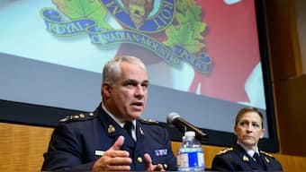 RCMP Commissioner Mike Duheme and Assistant Commissioner Brigitte Gauvin addressing press conference on Monday, October 14, 2024. Source: AP.