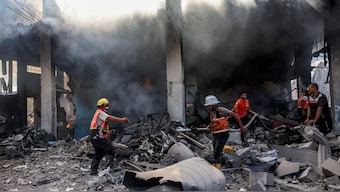 Palestinian civil defence firefighters extinguish a blaze in a building in Khan Yunis in the southern Gaza Strip on October 7, 2024 on the first anniversary of the ongoing war in the Palestinian territory between Israel and Hamas.- Photo- AFP