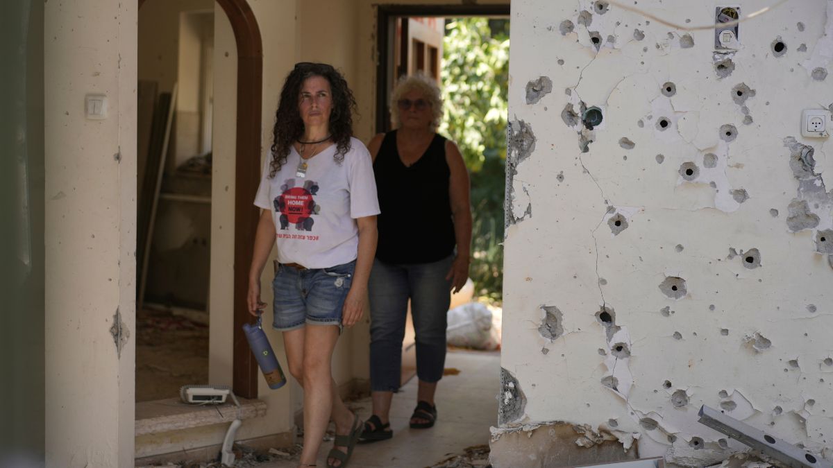 Liora Eilon, right, walks through her home that was destroyed by an Israeli tank on Oct. 7, with her daughter, Hadas Eilon-Carmi, left, in Kibbutz Kfar Aza, southern Israel, Sunday, Aug. 18, 2024.- Photo-AP Liora Eilon, right, walks through her home that was destroyed by an Israeli tank on Oct. 7, with her daughter, Hadas Eilon-Carmi, left, in Kibbutz Kfar Aza, southern Israel, Sunday, Aug. 18, 2024.- Photo-AP