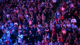 Supporters hold up signs as former US President and Republican presidential candidate Donald Trump speaks during a Turning Point Action 'United for Change' campaign rally in Las Vegas, Nevada on October 24, 2024. Image- AFP