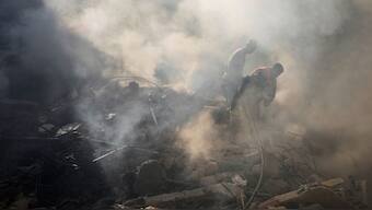 Rescue workers search for victims at the site of Thursday's Israeli airstrike in Beirut, Lebanon, Friday, Oct. 11, 2024. - Image- AP
