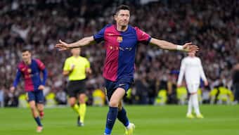 Robert Lewandowski celebrates after scoring Barcelona's opening goal in their 'Clasico' fixture against Real Madrid at Madrid's Santiago Bernabeu Stadium. AP