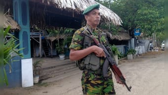 A police commando stands guard in front of a restaurant in Arugam Bay, Sri Lanka, October 23, 2024. File Image/AP