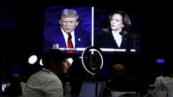 Members of the media use a screen to watch the presidential debate, as Republican presidential nominee, former US President Donald Trump and Democratic presidential nominee, US Vice President Kamala Harris attend a presidential debate hosted by ABC in Philadelphia, Pennsylvania, US, on September 10, 2024. Reuters File