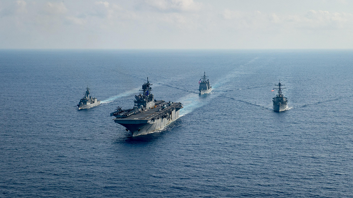 (File) Royal Australian Navy guided-missile frigate HMAS Parramatta (FFH 154) (L) sails with US Navy Amphibious assault ship USS America (LHA 6), Ticonderoga-class guided-missile cruiser USS Bunker Hill (CG 52) and Arleigh-Burke class guided missile destroyer USS Barry (DDG 52) in the South China Sea on April 18, 2020. Reuters (File) Royal Australian Navy guided-missile frigate HMAS Parramatta (FFH 154) (L) sails with US Navy Amphibious assault ship USS America (LHA 6), Ticonderoga-class guided-missile cruiser USS Bunker Hill (CG 52) and Arleigh-Burke class guided missile destroyer USS Barry (DDG 52) in the South China Sea on April 18, 2020. Reuters