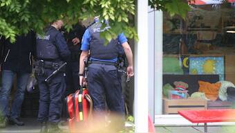 Police officers are seen outside of a daycare centre where a man attacked several children injuring three, before being arrested, in Zurich, Switzerland, on October 1, 2024. AFP