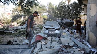 Palestinians inspect the site of Israeli strikes on houses, amid the Israel-Hamas conflict, in Khan Younis in the southern Gaza Strip, October 2, 2024. Reuters 