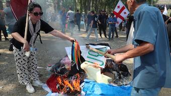 Anti-LGBTQ protesters who managed to break through the police cordon make a bonfire in the area designated for the Tbilisi Pride Fest, in Tbilisi, Georgia July 8, 2023. Reuters file